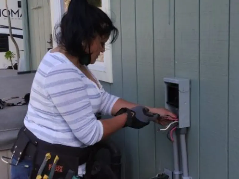 Licensed electrician wiring an exterior subpanel in Skidaway Island