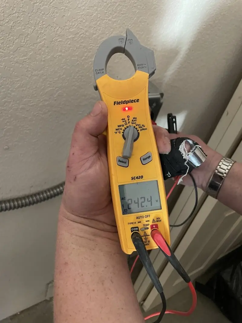Voltage testing with clamp meter during Outlet Installation in Skidaway Island